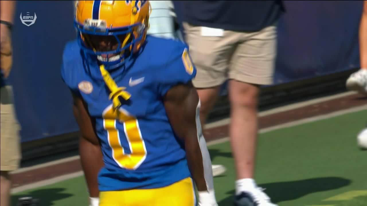 Desmond Reid hauls in the dime from Eli Holstein for a Pitt TD