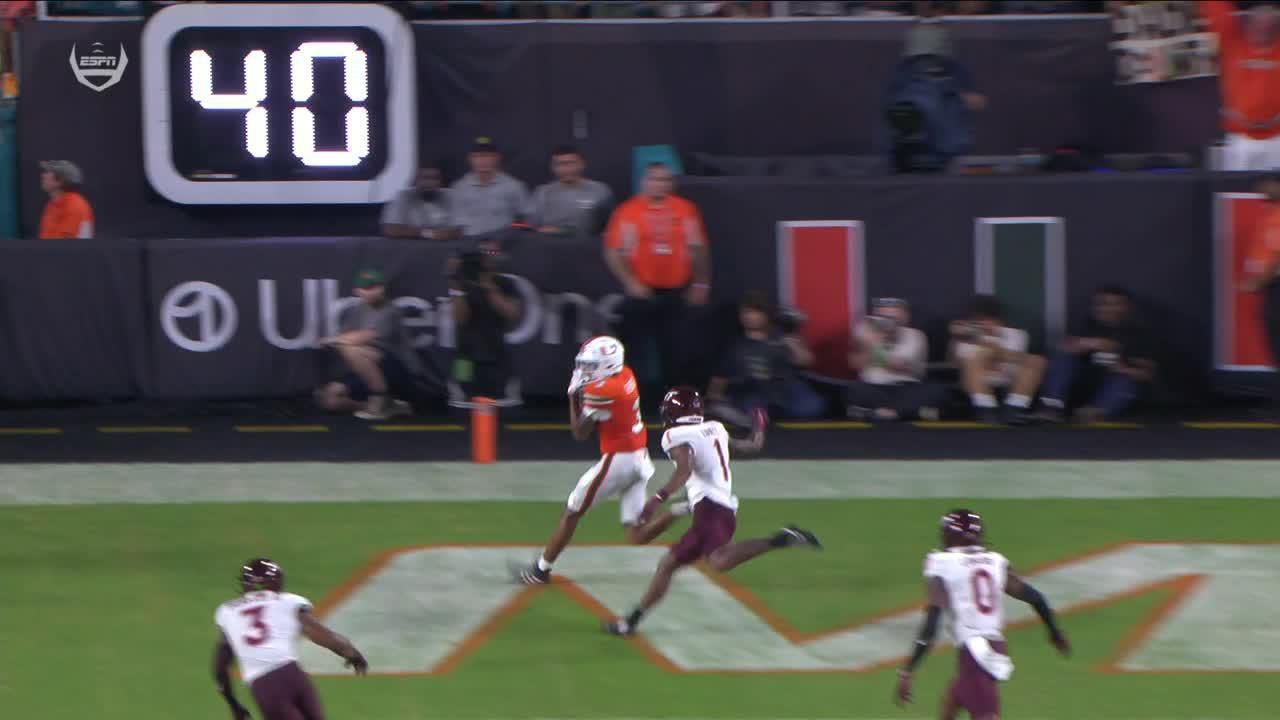 Miami's Cam Ward connects with Jacolby George for a TD