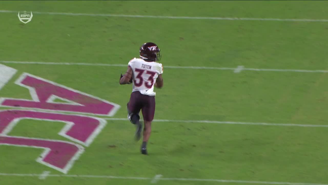 Bhayshul Tuten runs past the Miami defense for a TD