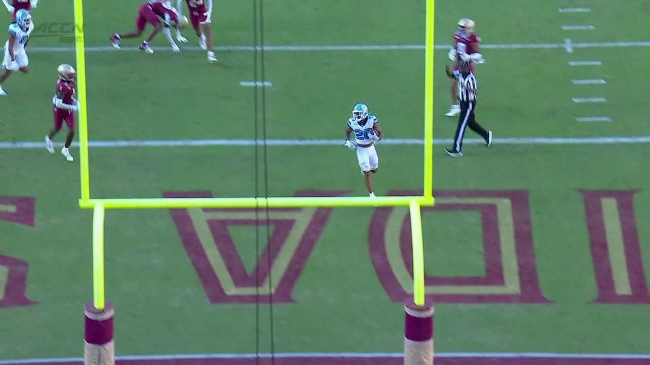 Omarion Hampton runs through a defender for a UNC TD